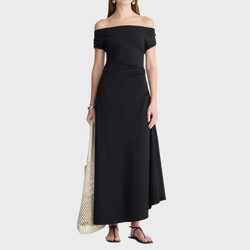 Woman wearing a black off-shoulder dress from LADDER, by Apiece Apart.