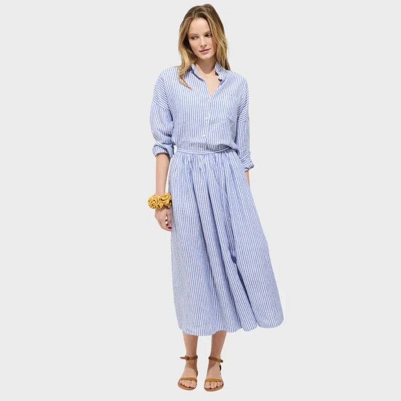 Model wearing a blue striped linen set from LADDER, designed by Alex Mill.