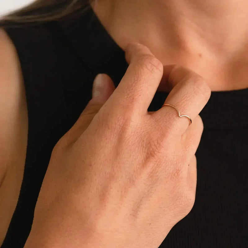 LADDER gold ring styled on hand with a black sleeveless top, by Sheena Marshall Jewelry