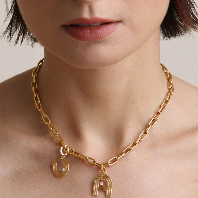 old charm chain necklace from LADDER, designed by Adina Reyter.