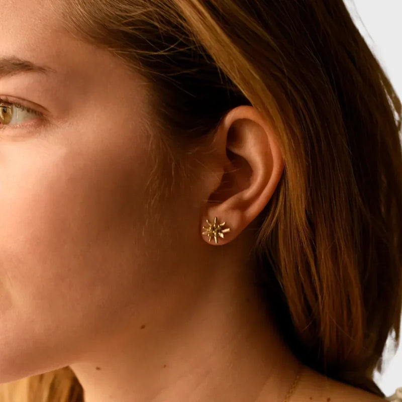 LADDER gold starburst stud earring worn on a model for an everyday jewelry look, by 8.6.4